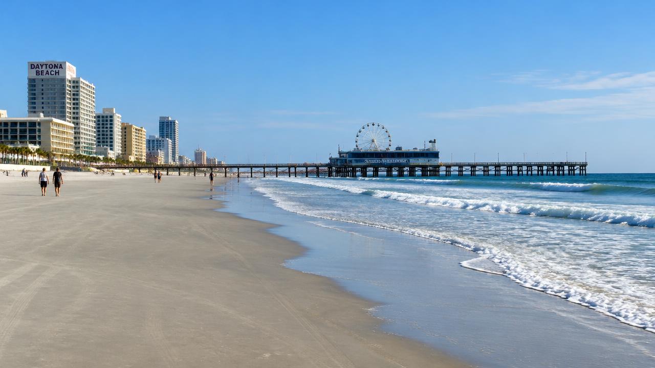 Daytona Beach sand and pier with oceanfront towers in Daytona Beach, Florida