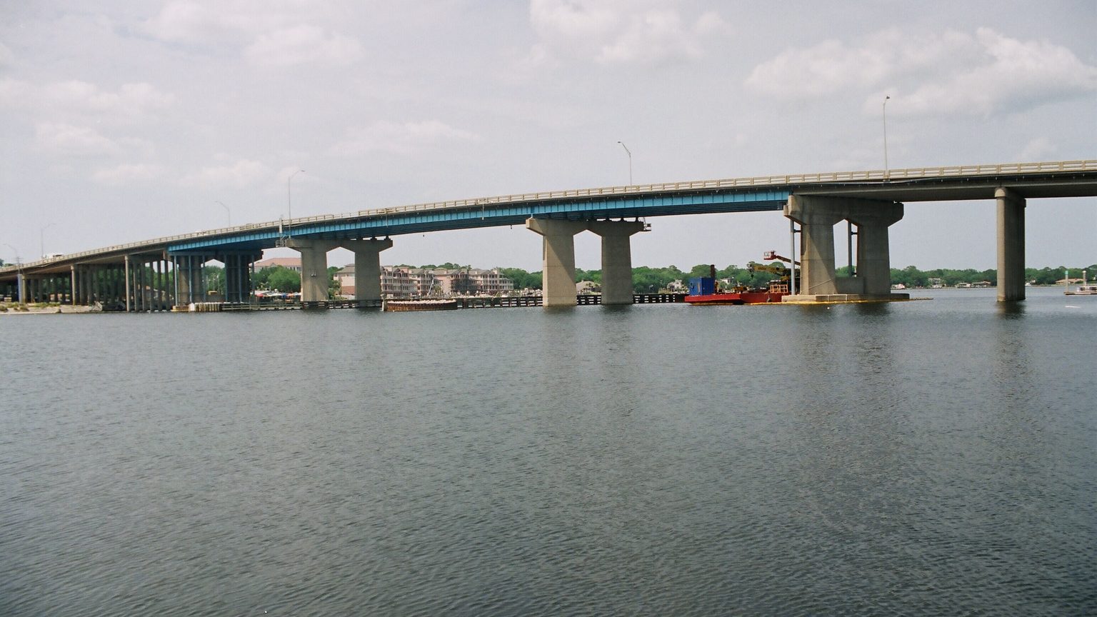 Aerial view of Brooks Bridge over the emerald Intracoastal Waterway in Fort Walton Beach, Florida