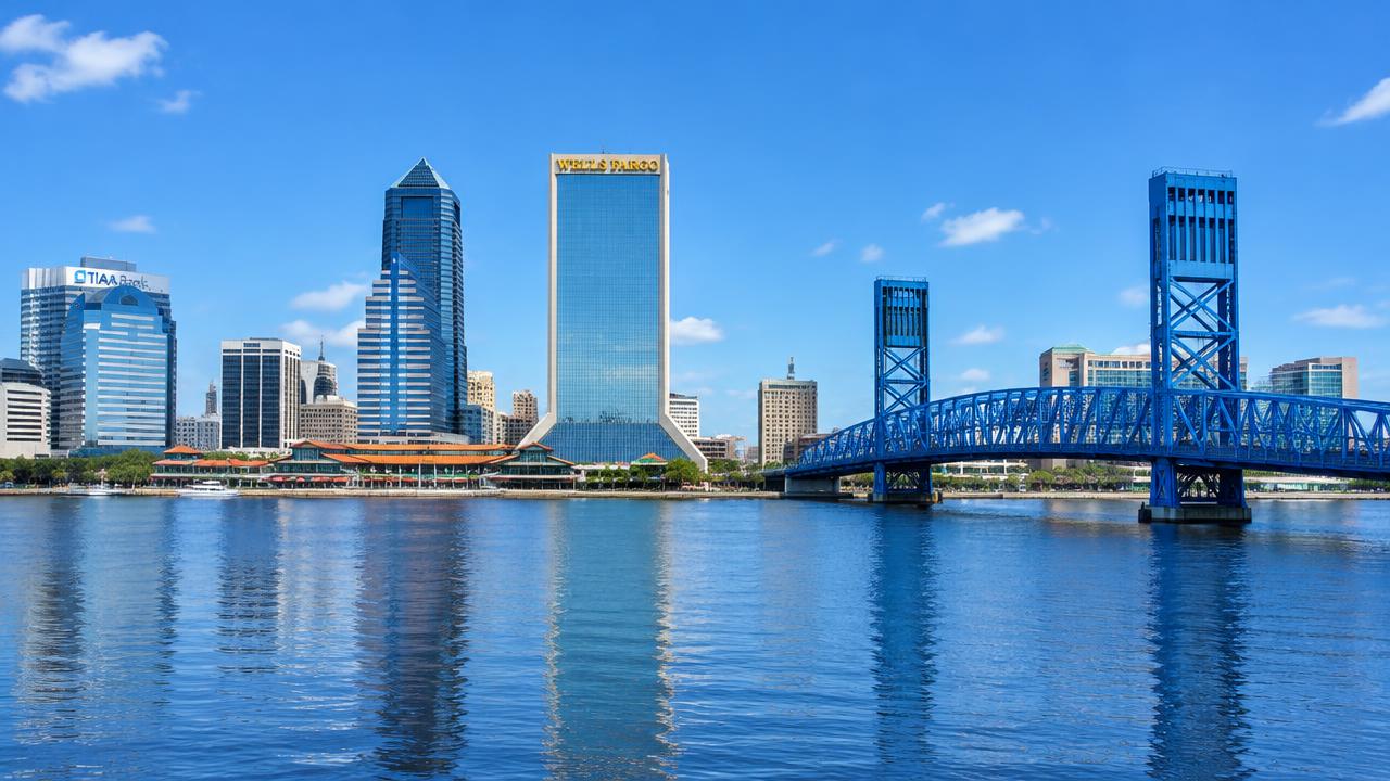 Jacksonville skyline over the St. Johns River with the blue Main Street Bridge