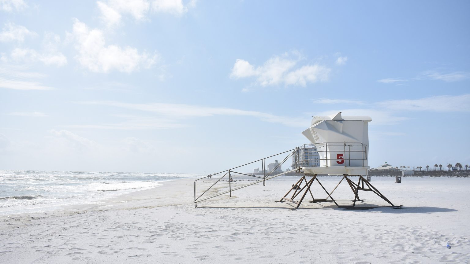 Pristine white sand and turquoise Gulf water at Pensacola Beach, Florida