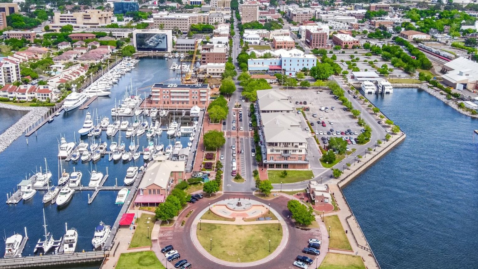 Historic Palafox Street in downtown Pensacola, Florida with palms and brick storefronts