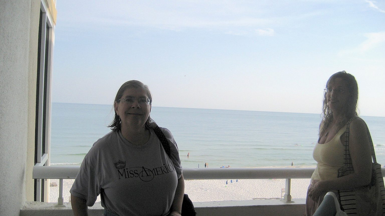 White sand dunes and sea oats overlooking emerald Gulf water at Perdido Key, Florida